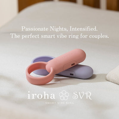 Two compact Iroha SVR smart vibe rings in soft pink and lavender on a neutral fabric surface.