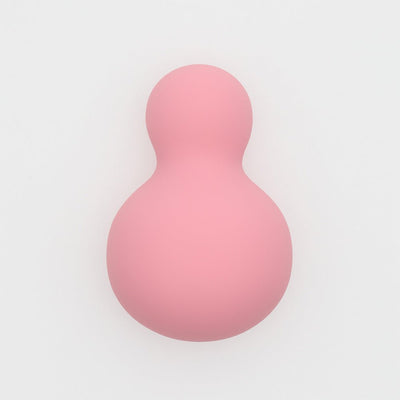 Soft pink snowman-shaped personal massager with smooth silicone finish for gentle, waterproof self-care.