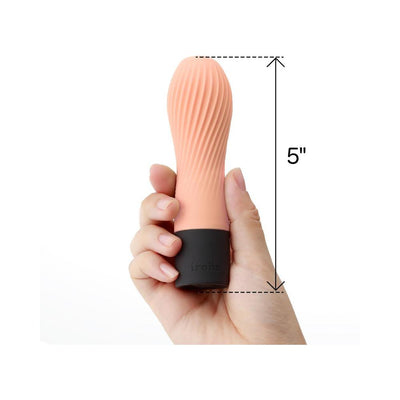 Hand holding a 5-inch compact Iroha Zen mini vibrator with textured silicone body and black base.