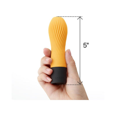 Hand holding a 5-inch compact Iroha Zen mini vibrator in citrus orange with textured silicone surface and black base.