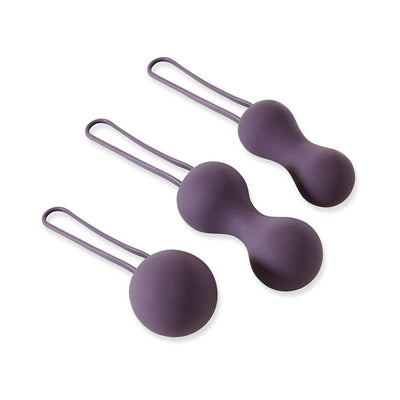 Set of three purple silicone kegel balls with ergonomic finger loops for pelvic floor exercise and strength training.