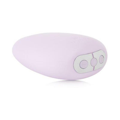 Soft lavender Je Joue Mimi clitoral vibrator with ergonomic shape and three control buttons on white background.