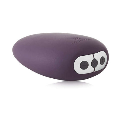 Je Joue Mimi clitoral vibrator in deep purple with ergonomic shape and control buttons on one end.
