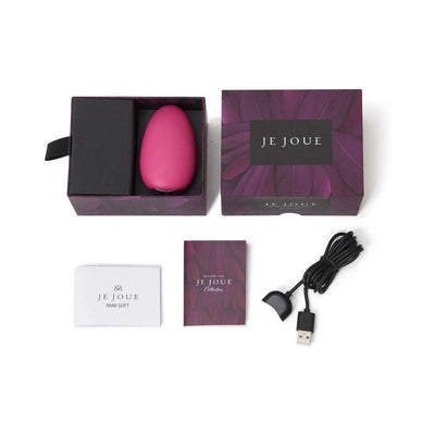 Je Joue Mimi Soft clitoral vibrator in purple packaging with USB magnetic charging cable and user manuals.