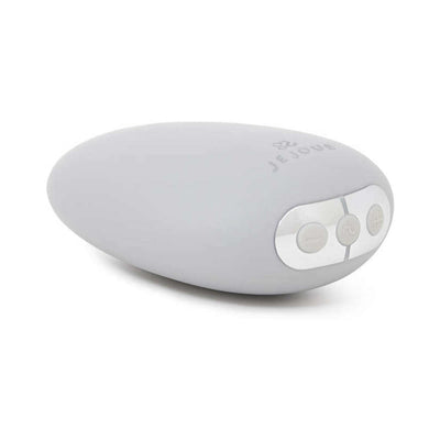 Je Joue Mimi Soft gray pebble-shaped clitoral vibrator with soft silicone tip and control buttons on white background.