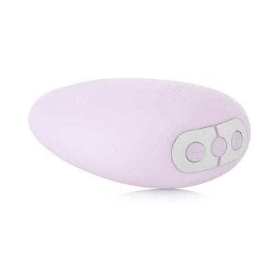 Light purple soft-tip clitoral vibrator with ergonomic pebble shape and three control buttons on one end.