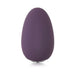 Je Joue Mimi Soft clitoral vibrator in deep purple with smooth, rounded pebble shape and subtle logo detail.