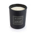 Je Joue black massage candle with ylang-ylang and mandarin scent in a sleek matte glass container.