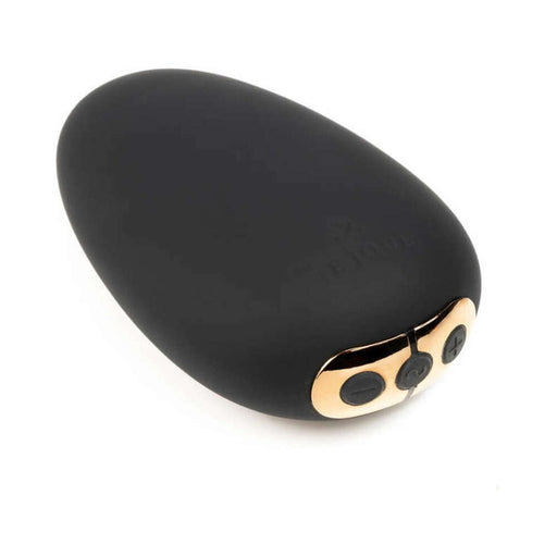 Black and rose gold compact Mimi vibrator with control buttons on a white background