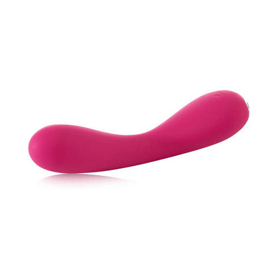Sleek curved pink silicone vibrator designed for G-spot stimulation with smooth, ergonomic shape and USB rechargeable feature.