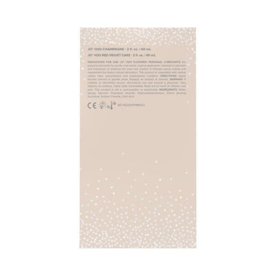 Back view of JO 20th Anniversary Gift Set packaging with product details and usage instructions on a beige background with white confetti design.