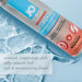 Bottle of JO H20 Warming water-based personal lubricant on a blue watery background with product benefits text.