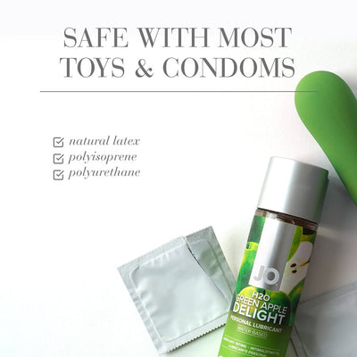 Jo H2O Green Apple flavored water-based lubricant bottle with condom packets and green silicone toy on white background.