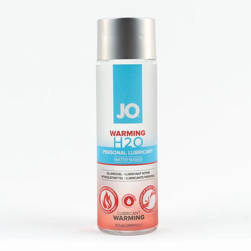 Bottle of Jo H2O Warming water-based personal lubricant with silver cap and blue and red label on white background.