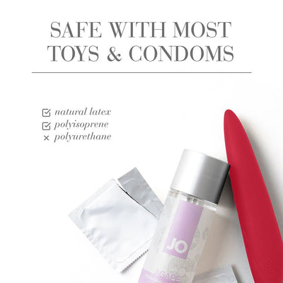 Jo Natural Agape Lubricant bottle with red silicone toy and two condom packets on white background with safety text.
