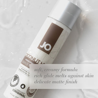 Bottle of Jo Silicone Free Hybrid Lubricant with creamy coconut formula on a smooth white surface.