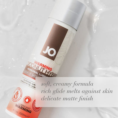 Bottle of Jo Silicone Free Hybrid Coconut Warming Lubricant on creamy white background with product benefits text overlay.