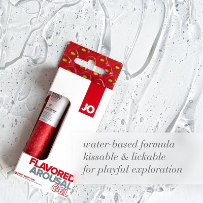 Jo Sweet Berry Heat flavored arousal gel in red and white packaging on a textured clear gel background.