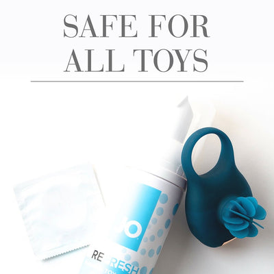 Jo Toy Cleaner 7oz bottle with foaming pump, a blue silicone ring toy, and a sealed wipe packet on white background.