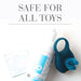 Jo Toy Cleaner 7oz bottle with foaming pump, a blue silicone ring toy, and a sealed wipe packet on white background.