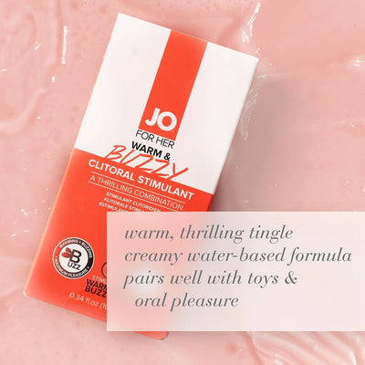 Jo Warm & Buzzy clitoral stimulant packaging on pink creamy background with product benefits text overlay.