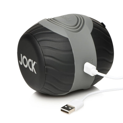 Compact black and gray vibrating double-ended male masturbator with USB charging cable and textured grip.