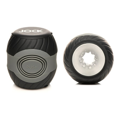 Compact black and gray vibrating double-ended male masturbator with textured grip and soft inner tunnel.