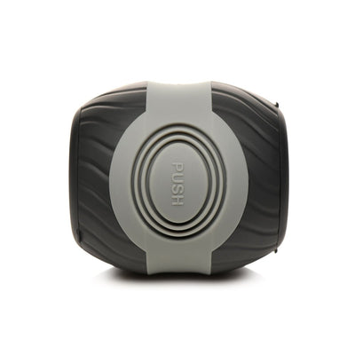 Black and gray dual-ended vibrating male masturbator with textured grip and central push button.