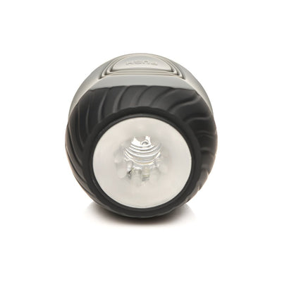 Front view of the Jock 10x Vibrating Double Masturbator showing textured black outer casing and clear inner tunnel opening.