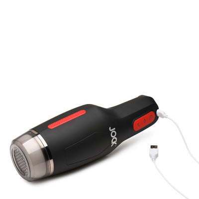 Black and red Jock 15x sucking and vibrating masturbator with USB charging cable attached on white background.