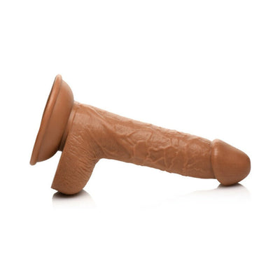 Medium-sized realistic brown dildo with suction cup base and attached balls, 7 inches long.