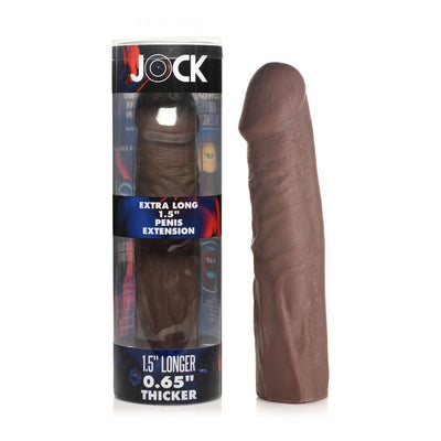 Dark brown extra long penis extension sleeve with realistic texture next to its clear cylindrical packaging.