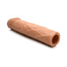 Medium-sized flesh-toned flexible penis extension sleeve with textured surface and hollow core.