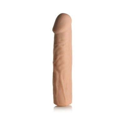 Light skin tone extra long penis extension sleeve with realistic texture and hollow shaft, standing upright on white background.