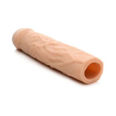 Light skin tone extra long textured penis extension sleeve with hollow center and open end on white background.