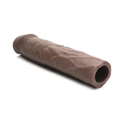 Medium brown flexible penis extension sleeve with lifelike texture and hollow center, designed to add 3 inches in length.