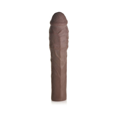 Dark brown extra thick penis extension sleeve with realistic texture and detailed design, standing upright on white background.