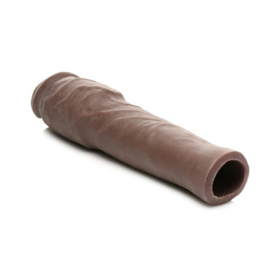 Dark brown flexible penis extension sleeve with hollow center and textured surface, designed for added length and girth.