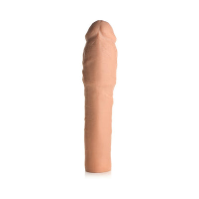 Medium-sized flesh-toned flexible penis extension sleeve with realistic texture and 2-inch length increase.