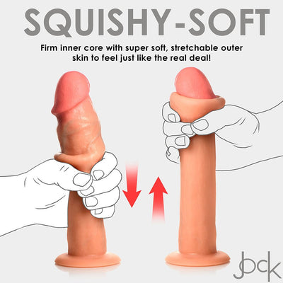 Illustration showing hands squeezing and stretching a realistic silicone dildo with firm core and soft, stretchable outer skin.