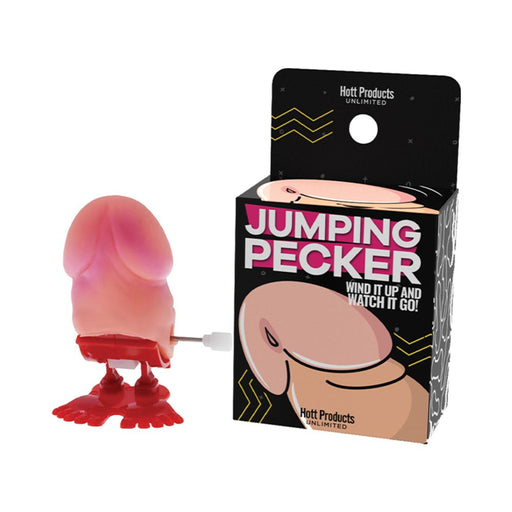 Wind-up jumping toy with red feet and packaging labeled Jumping Pecker for playful party fun.