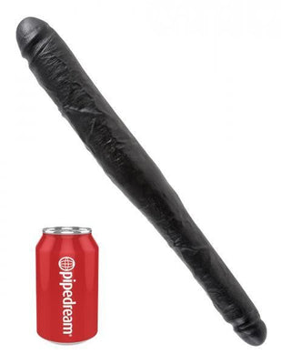 Black tapered double-ended dildo next to a red Pipedream soda can for size comparison.
