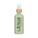 La Nua cucumber aloe water-based lubricant in a frosted green glass bottle with wooden pump top.