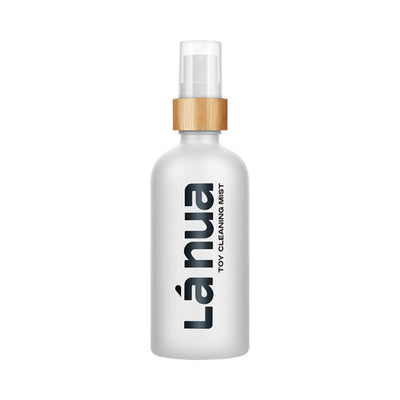 La Nua Mist Toy Cleaner 3.4 oz spray bottle with frosted glass and wooden accent cap.