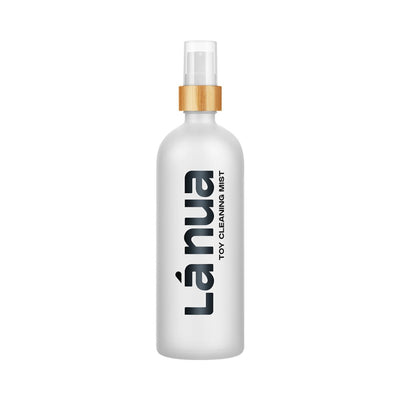 La Nua Mist Toy Cleaner 6.8 oz spray bottle with frosted finish and wooden accent on the spray nozzle.