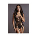 Model wearing black lace suspender bodystocking with halter neck and cut-out details against gray background.