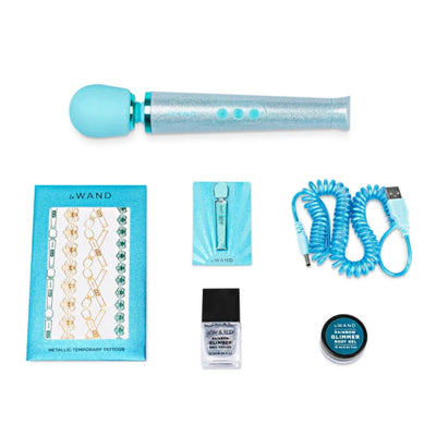 Le Wand All That Glimmers Set with blue wand massager, metallic temporary tattoos, nail polish, body gel, and USB charging cable.