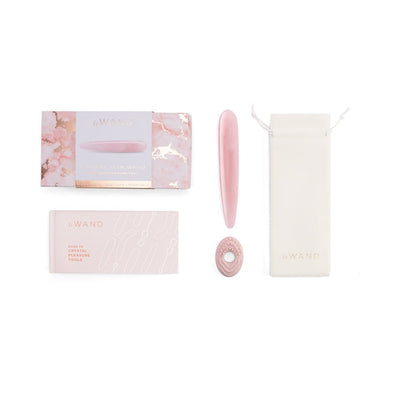 Le Wand Crystal Slim Wand set with pink wand, textured silicone ring, storage pouch, guidebook, and decorative box on white background.