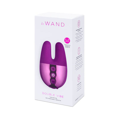 Packaging box of Le Wand Double Vibe twin motor rechargeable vibrator in purple and pink tones.