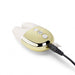 Le Wand Double Vibe in gold with white silicone ears, shown charging with control buttons visible on top.